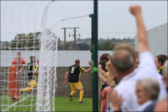 A City fan punches the air as Charlie Griffin celebrates his equaliser