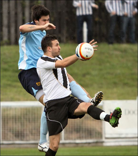 Ollie Barnes has his hands full against Cinderford's new striker Tom Billings
