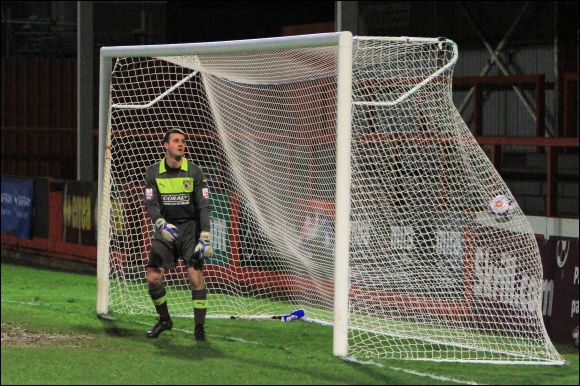 Barrow keeper Tony McMillan can only watch as Charlie Griffin's header hits the back of the net