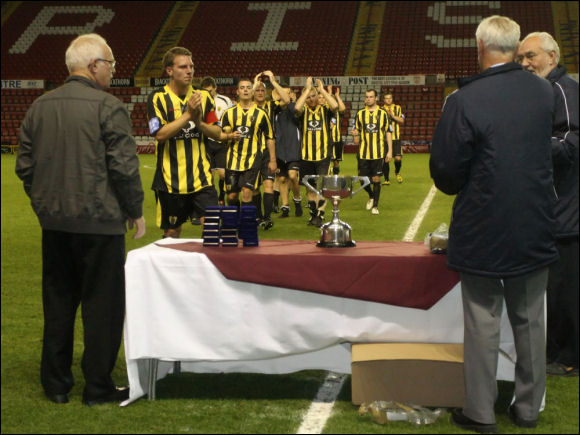 The City players collect their medals as runners-up