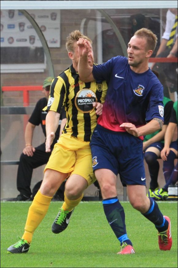 Winger Matt Groves takes an arm in the face during today's game
