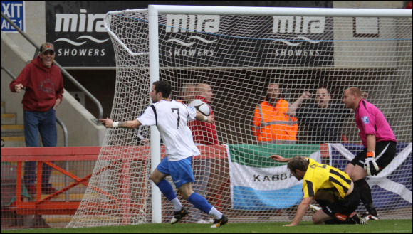 Weston's Kane Ingram wheels away in celebration after opening the scoring