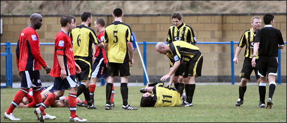 Jack Harris lies injured at Hinckley whilst Neil Mustoe makes his feelings known to the referee