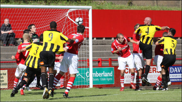 Marc Richards heads home City's consolation goal at Workington on Saturday August 14th 2010