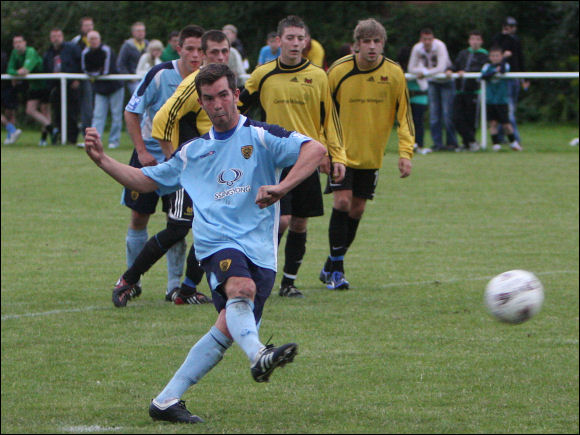 Sam Robinson cooly slots the ball home from the penalty spot for City's 2nd