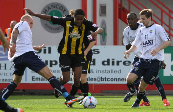 Scott Wilson is brought down against Guiseley and City have a penalty